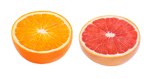 Citrus fruit on dark plate and black background, flat lat, from above.