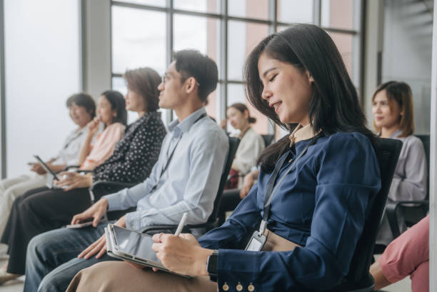 istock Smart woman  listening and making a notes about the new project on tablet  at board room. 1533853542