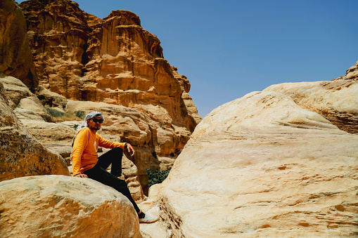 An Asian Traveler admiring the treasury of Petra, named El Khasneh al Faroun