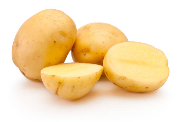 istock Raw potatoes freshly cut in half isolated on white background 1533856365
