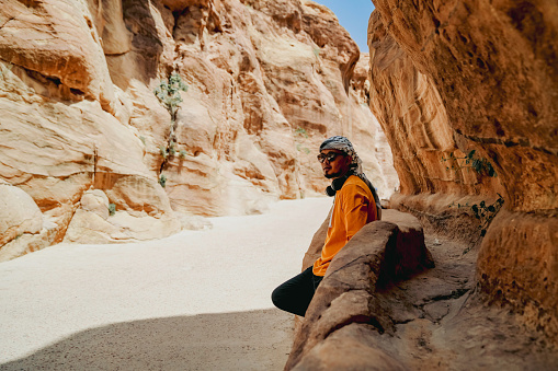 An Asian Traveler admiring the treasury of Petra, named El Khasneh al Faroun