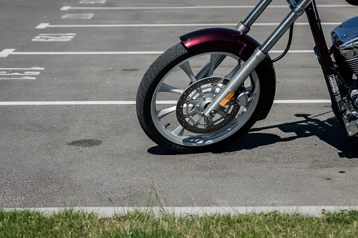 Minsk, Belarus, July 2023 -  wheels of a motorcycle made by Honda in the parking lot