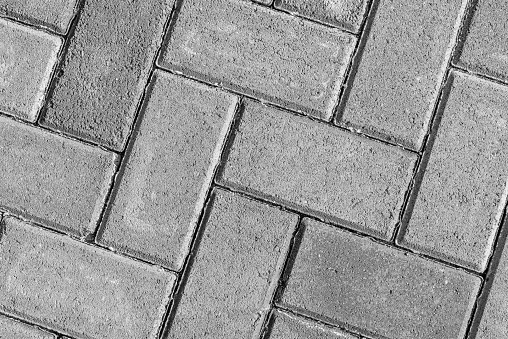 Paving stone texture. The texture of the paved tiles at the bottom of the street. Concrete paving slabs.