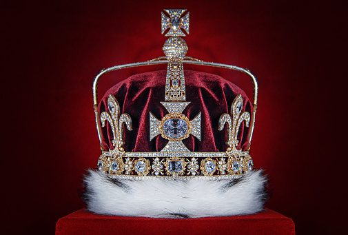 Crown. Golden crown on red velvet background.