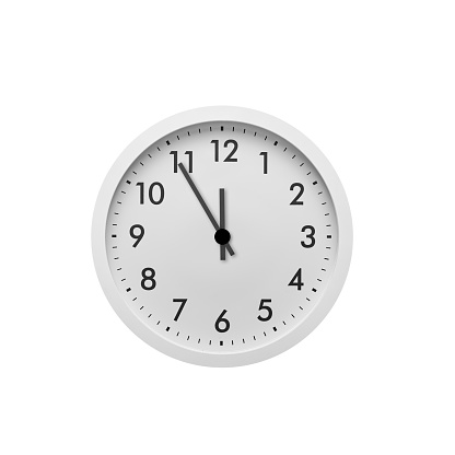 Five minutes to twelve on the clock. Round clock with arrows isolated on white background.