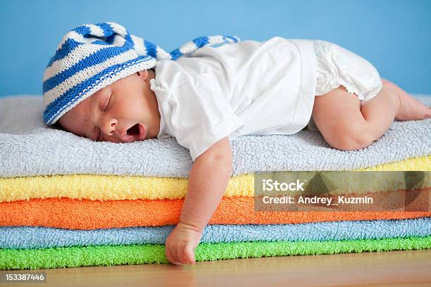 Yawning Sleeping Baby On Colorful Towels Stack Stock Photo - Download Image Now - Babies Only, Baby - Human Age, Beauty