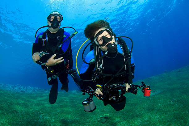 istock Couple Scuba Diving together 153388443