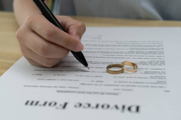 istock Quarrel, Divorce. husband and wife remove married ring. Couples desperate and disappoint after marriage. Divorce document, upset and frustrated after conflict. distrust, love problems, betrayals 1533884879