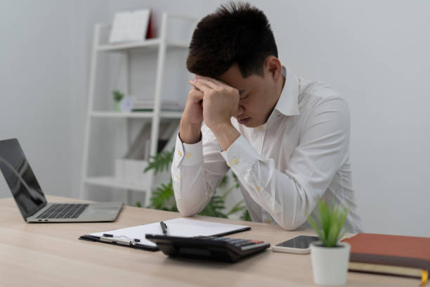 istock Asian man disappoint, sad after receive bad news. Stressed boy confused with unhappy problem, arguing with girlfriend, cry and worry about unexpected work, down economy. 1533885201