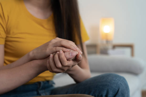 istock Couple hold hand support each while discussing family issues with psychiatrist. Husband encourages and empathy wife suffers depression. psychological, save divorce, Hand in hand together, trust, care 1533885738