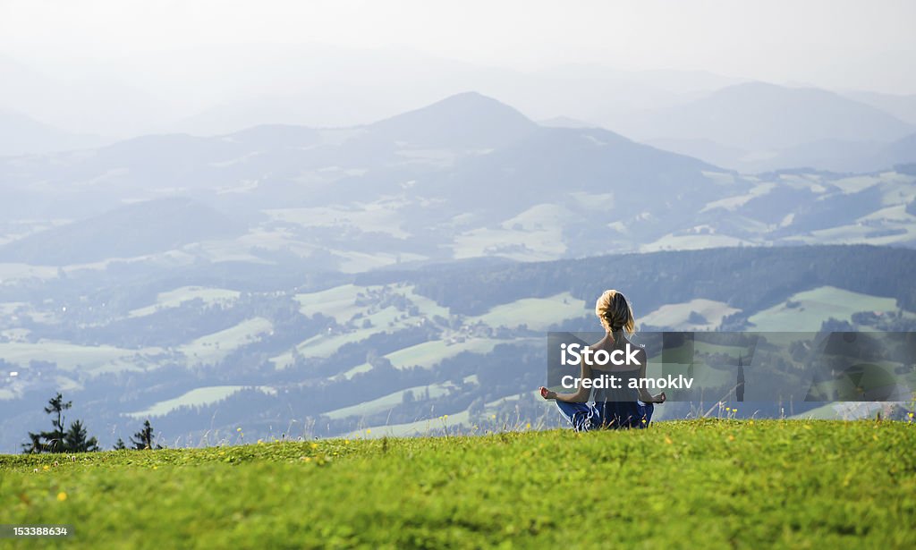 Woman meditating Young woman meditating outdoors.Photo taken in Graz, Austria Austria Stock Photo