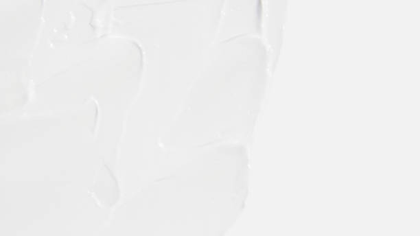 istock White cosmetic cream smeared on a white background 1533893836