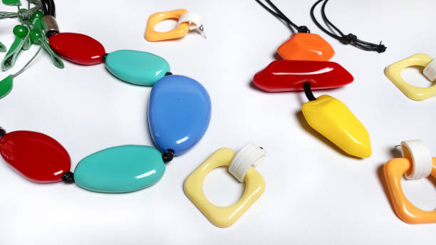 Plastic imitation jewellery on white background