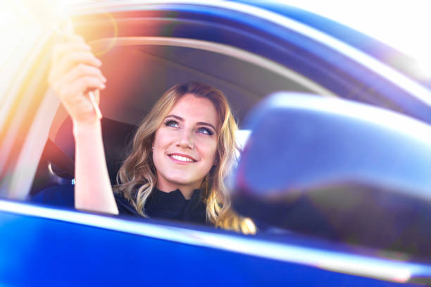 istock A woman's hand passes the key to the car. 1533915821