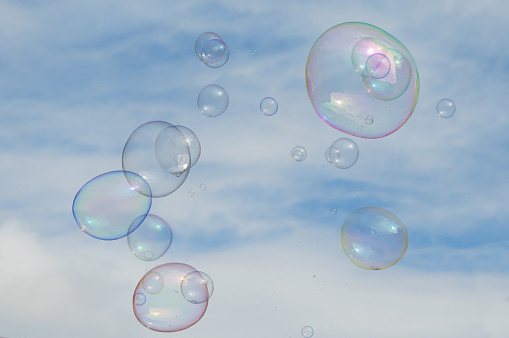 Soap bubbles flying up into the sky
