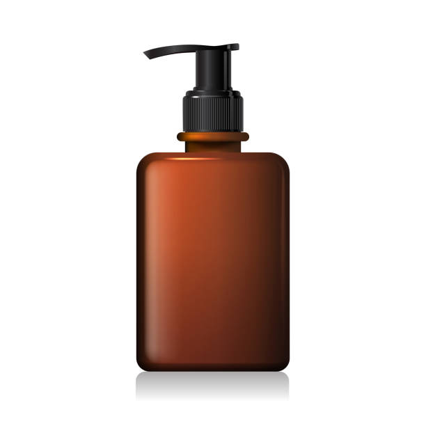 istock Blank frosted brown glass bottle mockup with black pump 1533929204