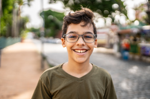 Portrait of happy boy on the street