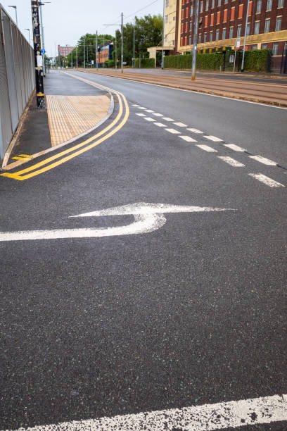 istock road markings at a give way junction with white painted direction arrow 1533952220