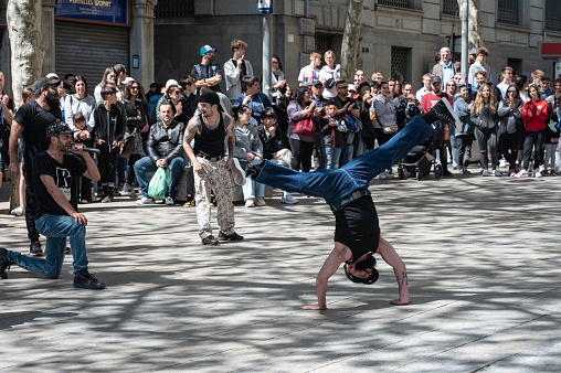 Barcelona, Spain – May 13, 2023: Street dancers doing an exhibition in the streets of the city