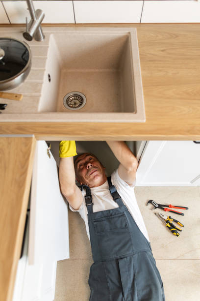 istock The plumber fixing the sink in the kitchen 1533987638