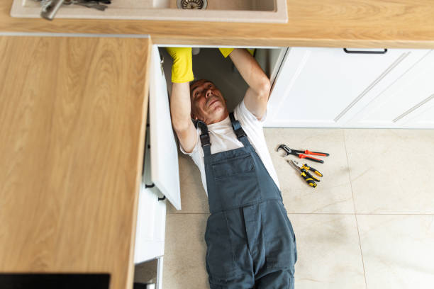 istock The plumber fixing the sink in the kitchen 1533989242