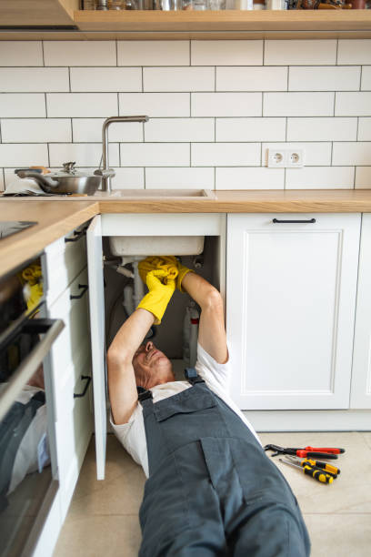 istock The plumber fixing the sink in the kitchen 1533990312
