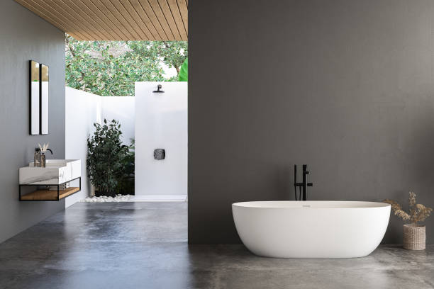istock Modern bathroom interior with dark walls, marble basin with double mirror, bathtub, open air shower and grey concrete floor. Minimalist black bathroom with modern furniture. 3D rendering 1533994446