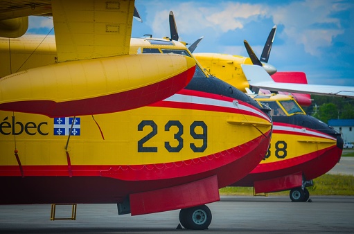 Val dOr, Canada – June 18, 2023: Three Quebec firefighting planes on the ground in Val-d'Or, SOPFEU installation