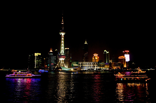 Night Views of the Pudong part of Shanghai, China, very modern sklyline, The Oriental Pearl TV tower, photographed from the Bund, Yangzi River. Lujiazui from The Bund.