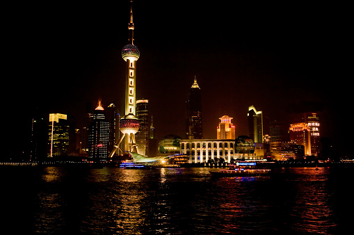 Night Views of the Pudong part of Shanghai, China, very modern sklyline, The Oriental Pearl TV tower, photographed from the Bund, Yangzi River. Lujiazui from The Bund.