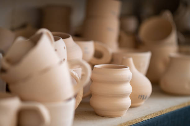 istock Pottery shelf in studio, creative store clay products, collection and display in workshop. 1534018628