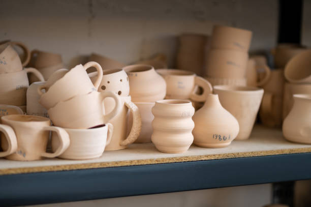 istock Pottery shelf in studio, creative store clay products, collection and display in workshop. 1534018734