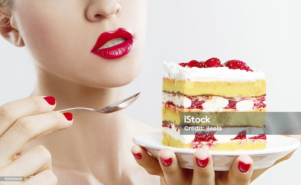 eating a strawberry cake caucasian woman eating a strawberry cake Women Stock Photo