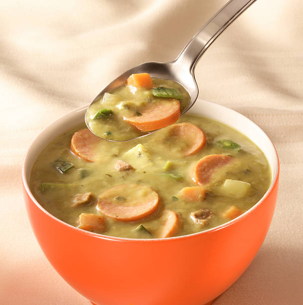 bowl of pea soup stock photo