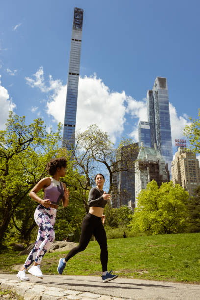 istock Urban Fitness: Friends Jogging with NYC Skyline in View 1534034721