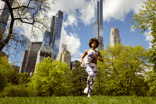 Empowered Black Woman Jogging in Central Park, NYC. 
Fun Fact: Central Park is a haven for over 200 species of birds.