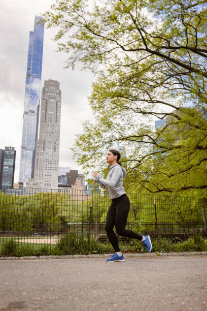 istock Young Woman's Morning Jog in Central Park, NYC 1534038304