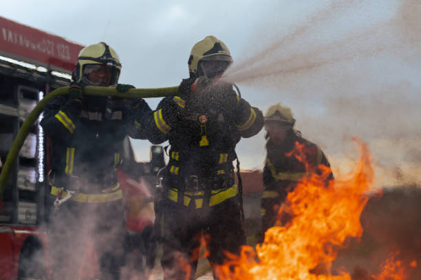 istock Firefighters fight the fire flame to control fire not to spreading out. Firefighter industrial and public safety concept. Traffic or car accident rescue and help action. 1534038458