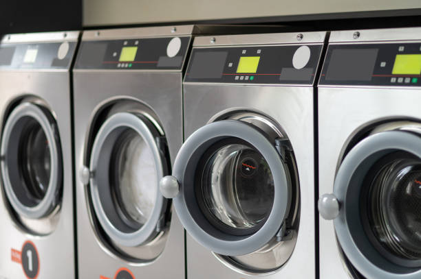 istock Industrial laundry machines in a public laundromat. 1534086901