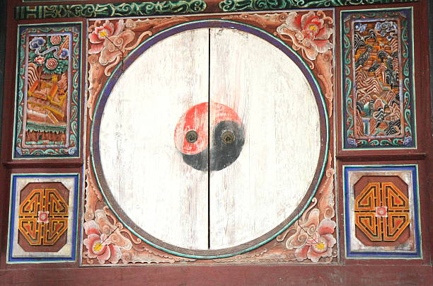 istock Yin-yang symbol in polychrome wooden door. 153408821