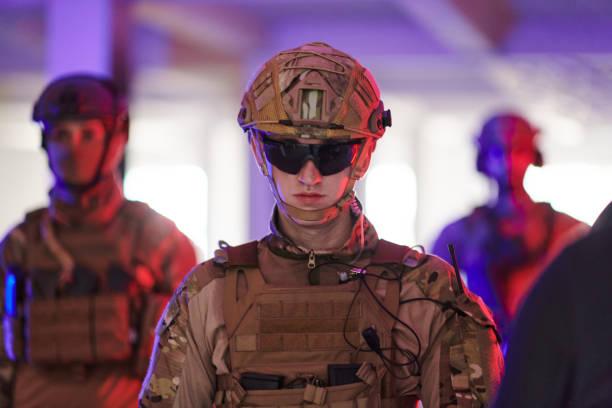 istock Soldier squad team walking in urban environment colored lightis 1534089009