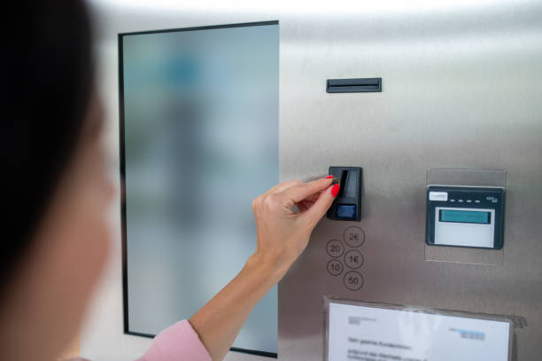 istock Woman buying coffee from automatic vending machine. 1534089540