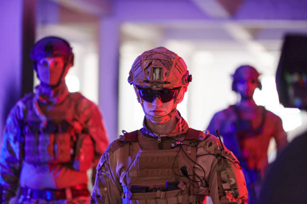 istock Soldier squad team walking in urban environment colored lightis 1534092258
