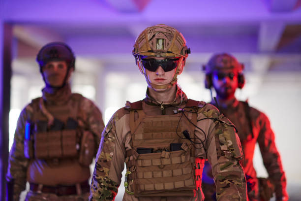 istock Soldier squad team walking in urban environment colored lightis 1534099493
