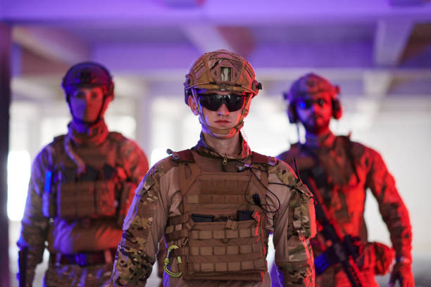 istock Soldier squad team walking in urban environment colored lightis 1534103569