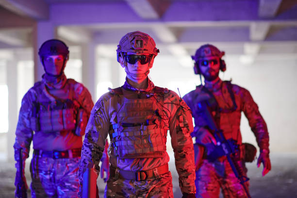 istock Soldier squad team walking in urban environment colored lightis 1534108311