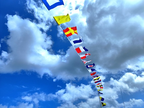 red, white and blue flags on a blue sky background