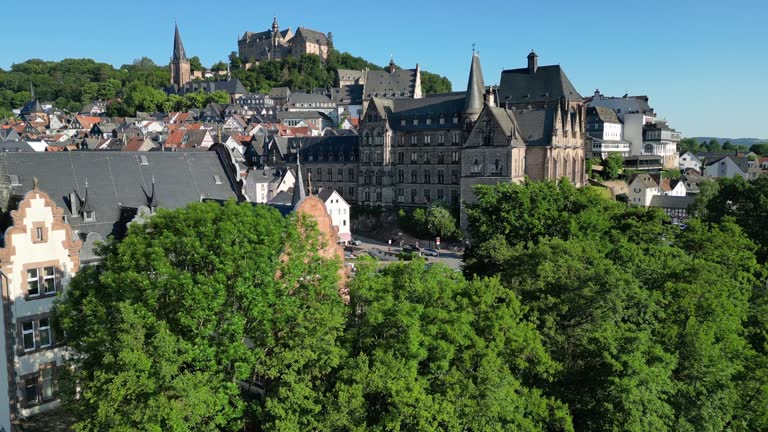 drone flight over river in historic Marburg