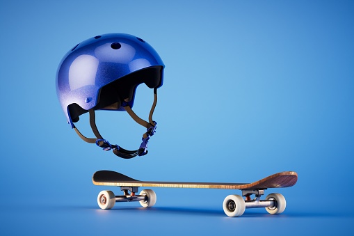 The concept of extreme sports. A blue skateboard and protective helmet on a blue background. 3D render.