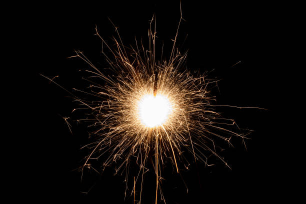 istock Burning sparkler isolated on black background. Fireworks theme. Light effect and texture. 1534185803